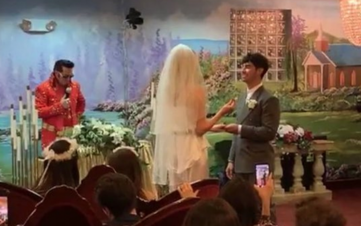 Joe wore an elegant gray suit while Sophie wore a  traditional veil and white dress for their wedding.